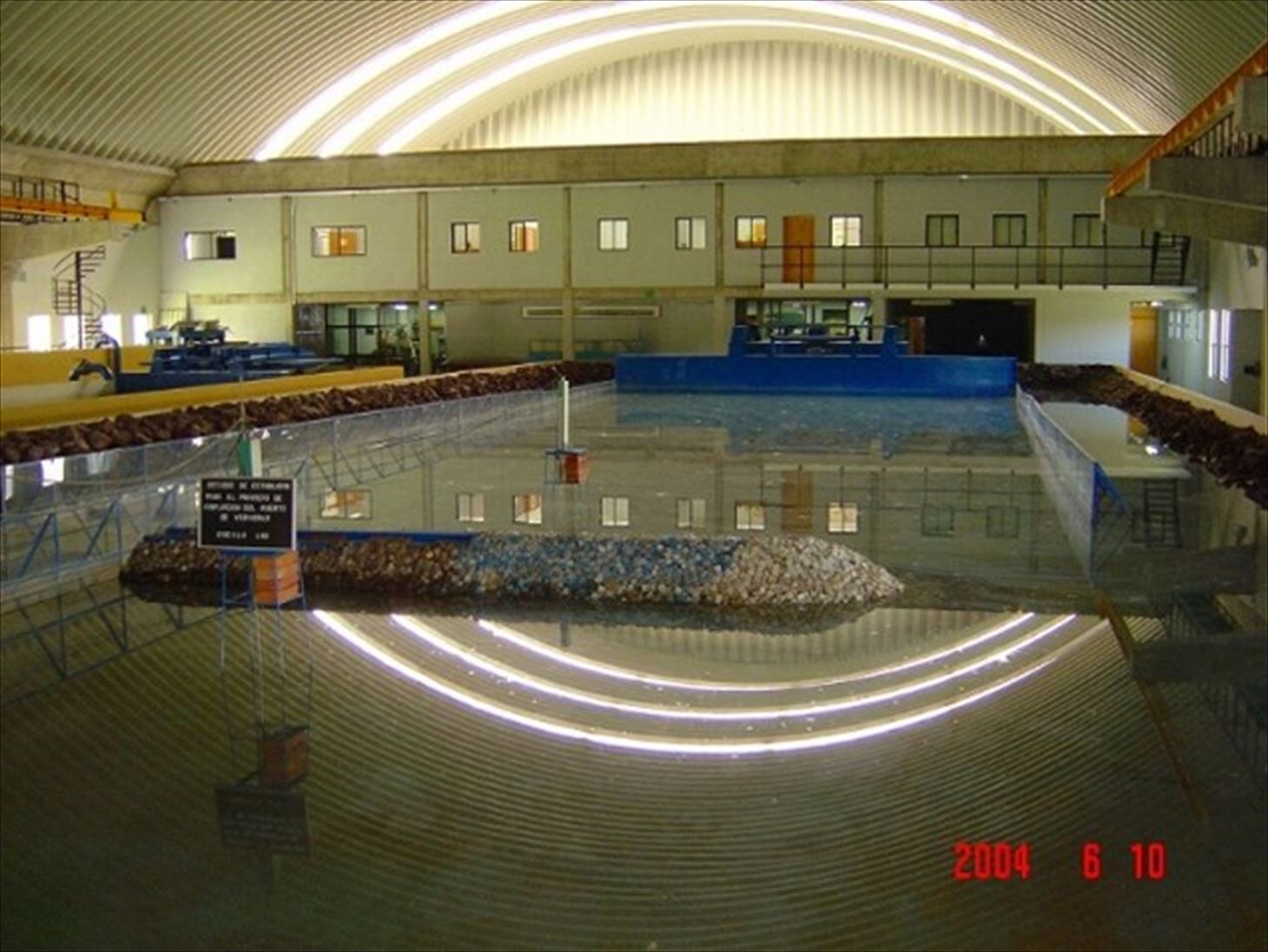 Photo 9: Experimental wave tank of the MTI (June 2004) (The wave generators in the front were provided from Japan)